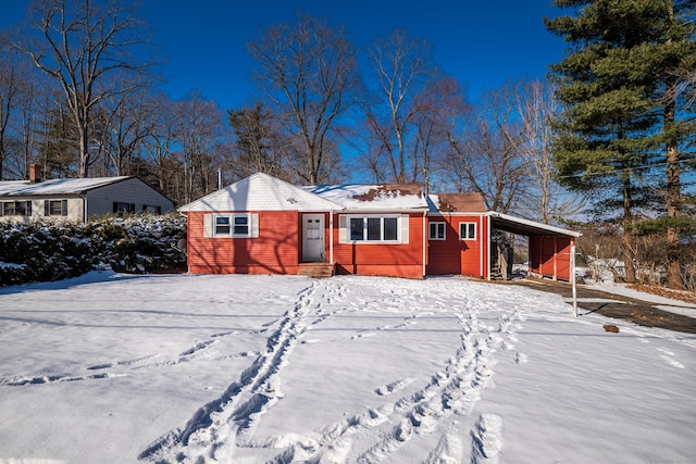 view of front of property featuring a carport