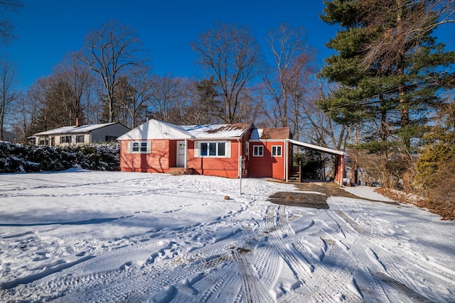 view of front of property featuring a carport