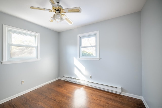 unfurnished room with hardwood / wood-style floors, a baseboard radiator, a wealth of natural light, and ceiling fan