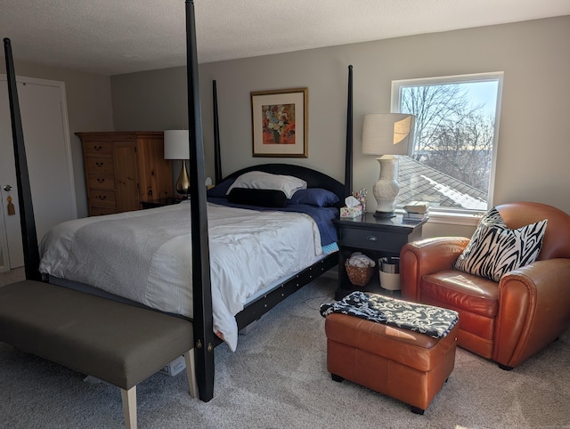 carpeted bedroom featuring a textured ceiling