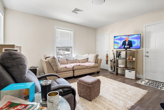 living room with dark hardwood / wood-style flooring