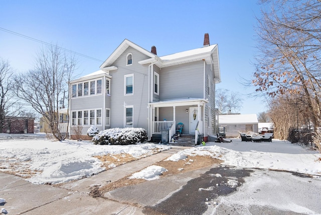 view of property featuring covered porch