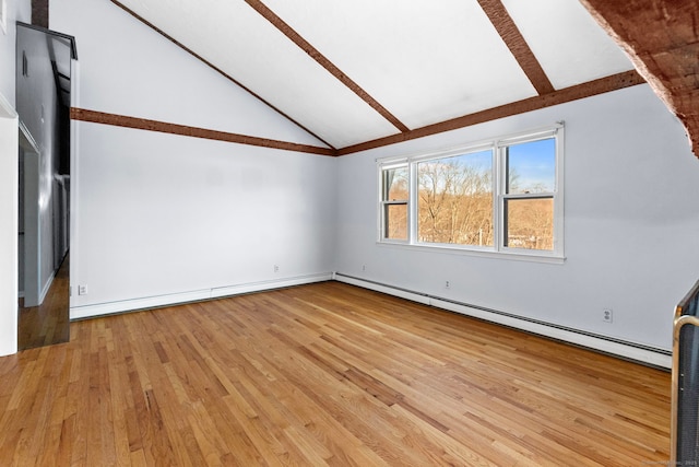 interior space with a baseboard radiator, vaulted ceiling, and light wood-type flooring