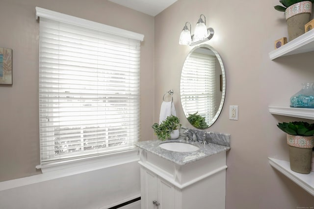 bathroom featuring a baseboard radiator and vanity