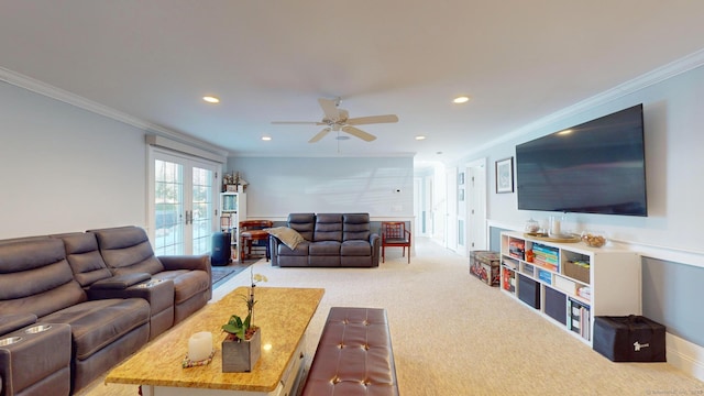 carpeted living room with crown molding, ceiling fan, and french doors