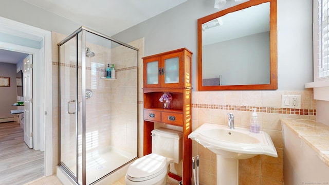 bathroom with toilet and walk in shower