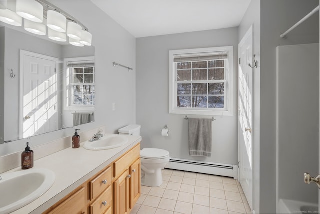 bathroom with baseboard heating, toilet, tile patterned floors, and vanity