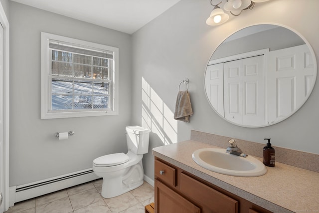 bathroom featuring a baseboard radiator, toilet, tile patterned flooring, and vanity