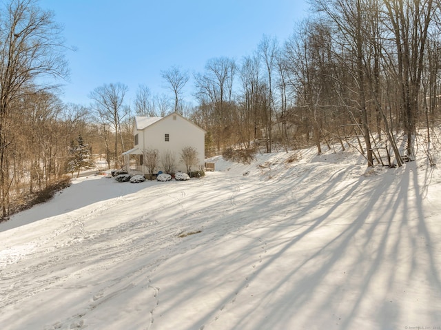 view of yard layered in snow