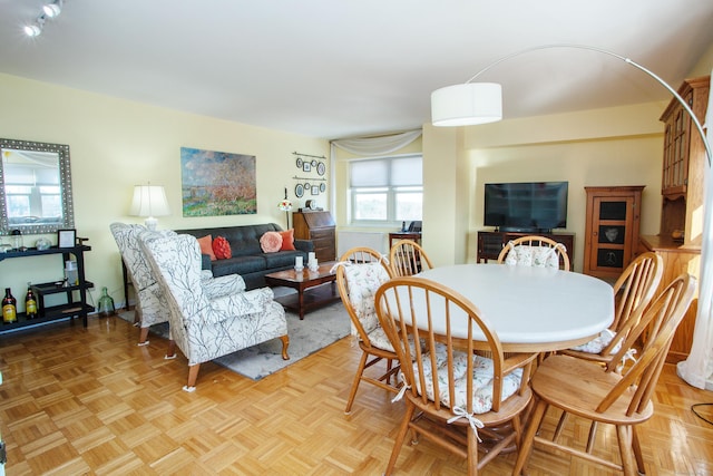 dining area with light parquet floors