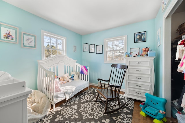 bedroom with dark wood-type flooring