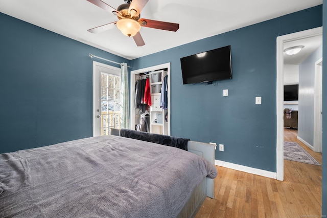 bedroom with ceiling fan, a closet, and light hardwood / wood-style flooring