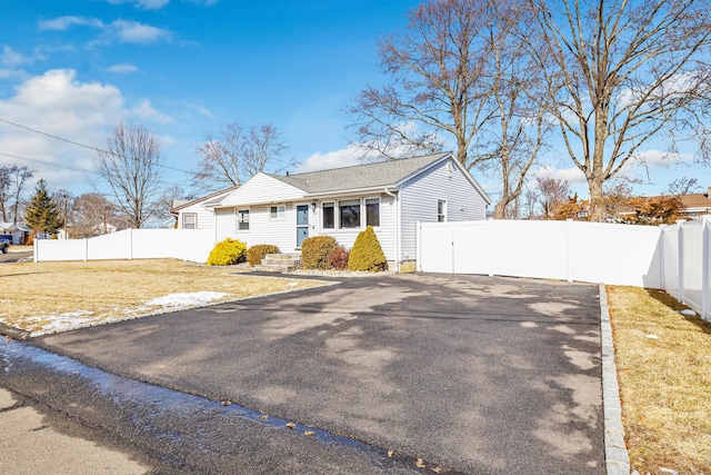 63 Contact Dr, West Haven, CT 06516 - view of front of property with roof with shingles, fence, and a front yard