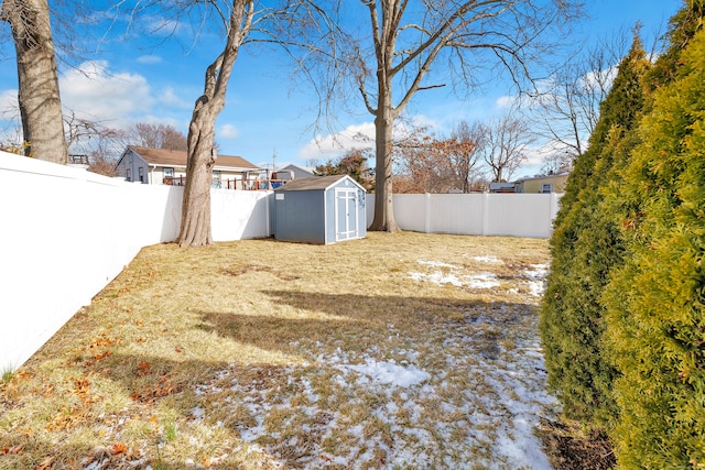 63 Contact Dr, West Haven, CT 06516 - view of yard featuring a fenced backyard, a storage unit, and an outdoor structure