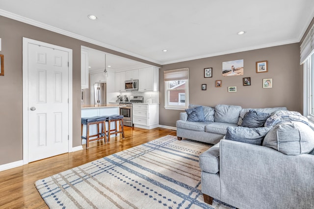 63 Contact Dr, West Haven, CT 06516 - living area featuring crown molding, recessed lighting, and light wood-style flooring