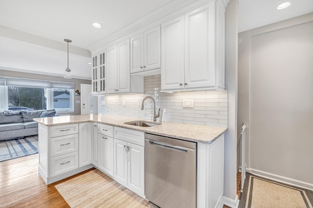 63 Contact Dr, West Haven, CT 06516 - kitchen featuring a sink, white cabinetry, dishwasher, and decorative backsplash