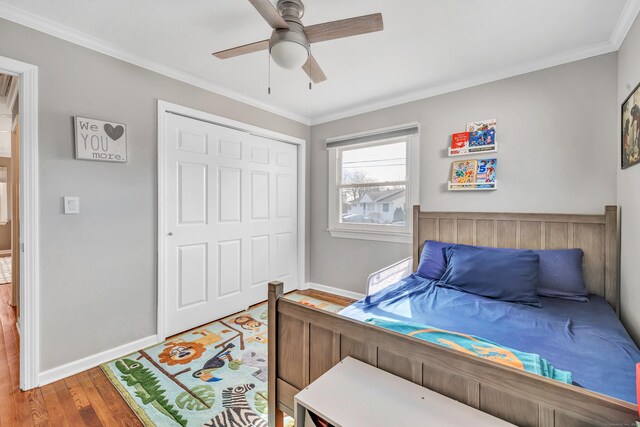 63 Contact Dr, West Haven, CT 06516 - bedroom with ceiling fan, crown molding, wood finished floors, baseboards, and a closet