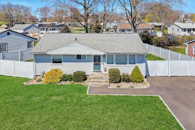 63 Contact Dr, West Haven, CT 06516 - ranch-style home with a front lawn, roof with shingles, and a residential view