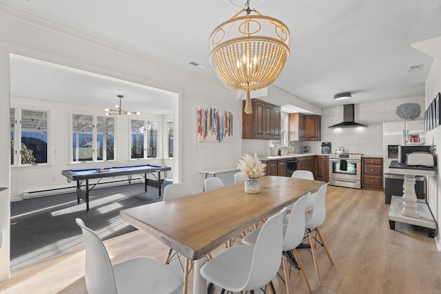 dining room with light hardwood / wood-style flooring, a notable chandelier, ornamental molding, pool table, and a baseboard radiator