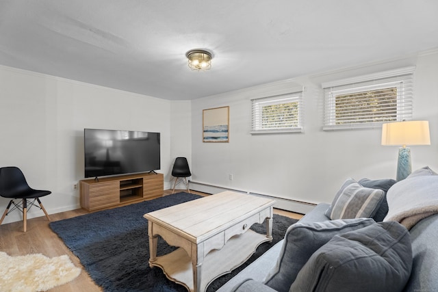 living room with crown molding, a baseboard radiator, and light hardwood / wood-style flooring