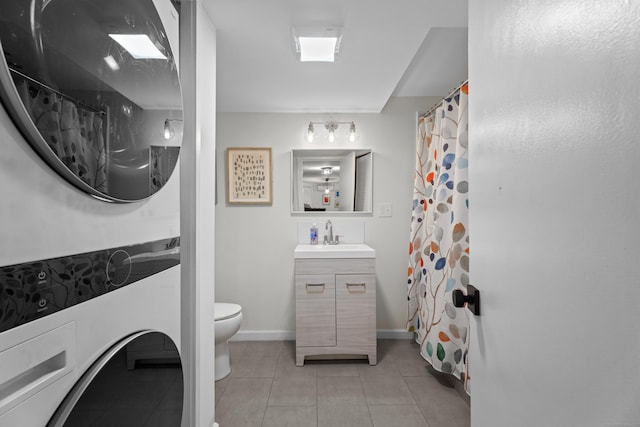 bathroom with vanity, a shower with shower curtain, tile patterned floors, and toilet