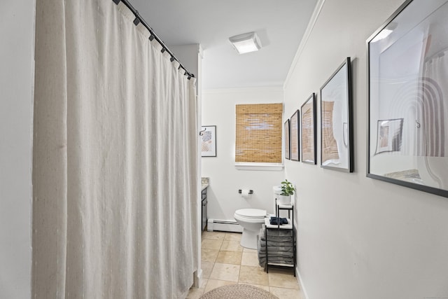 bathroom featuring crown molding, tile patterned flooring, a baseboard heating unit, vanity, and toilet