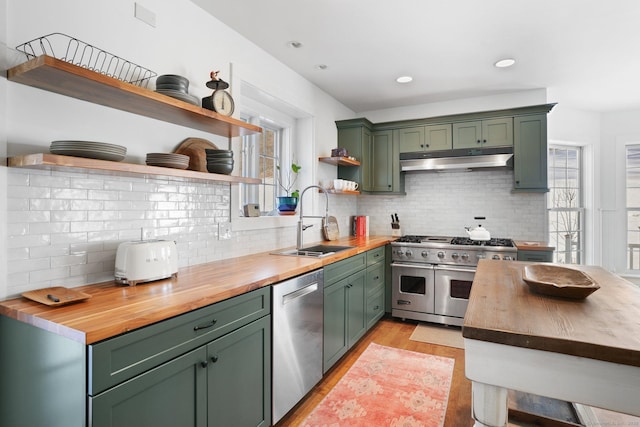 kitchen featuring wooden counters, open shelves, and green cabinetry