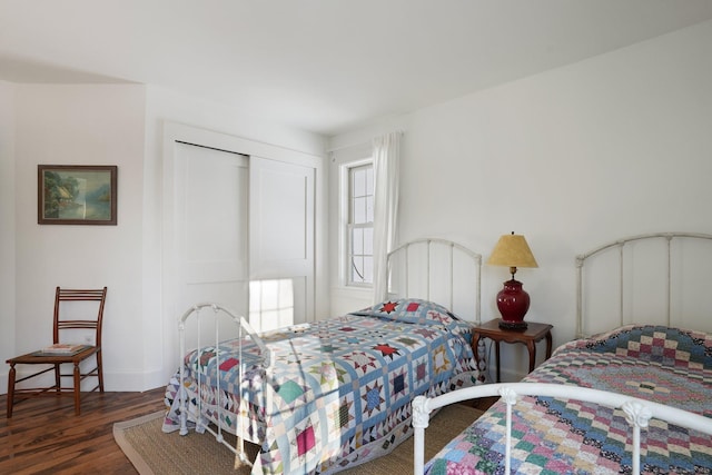 bedroom featuring a closet and wood finished floors