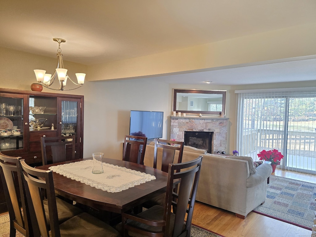 dining space featuring a notable chandelier and hardwood / wood-style flooring