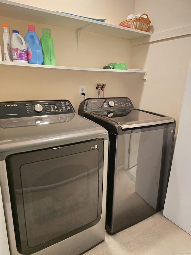 laundry room featuring washing machine and clothes dryer