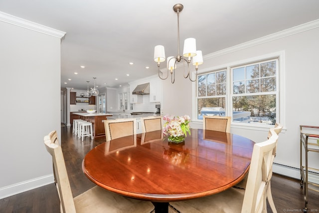 dining space with crown molding, dark wood-type flooring, and a chandelier