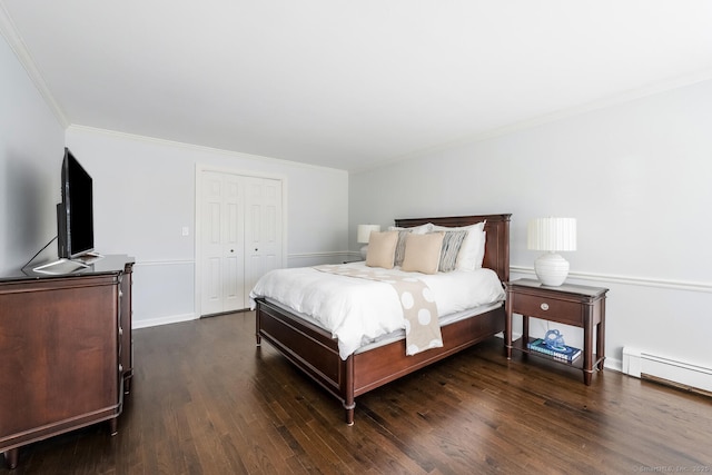 bedroom with a baseboard radiator, crown molding, dark hardwood / wood-style flooring, and a closet