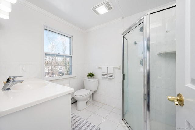 bathroom with a shower with shower door, tile patterned flooring, vanity, toilet, and crown molding