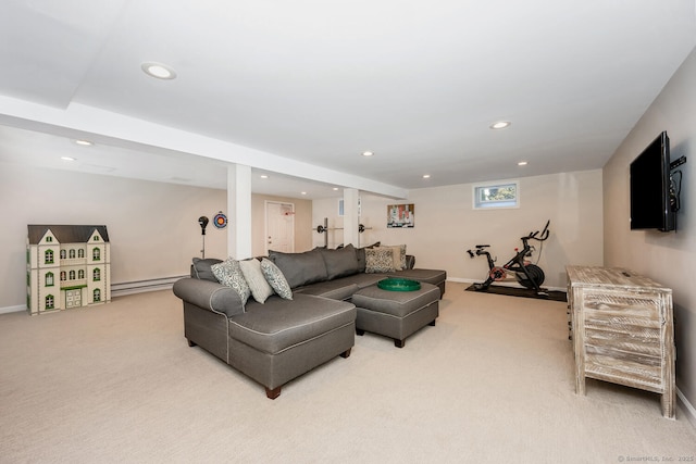 carpeted living room with a baseboard heating unit