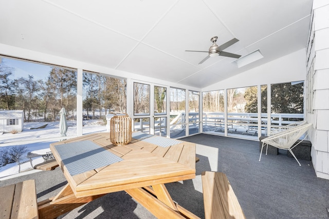 sunroom featuring vaulted ceiling and ceiling fan