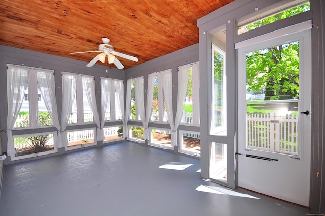 unfurnished sunroom with wooden ceiling