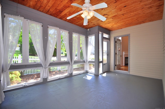 unfurnished sunroom featuring wooden ceiling