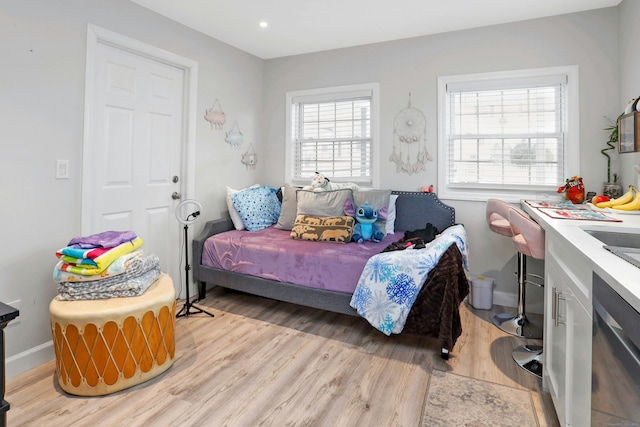 bedroom with light hardwood / wood-style floors