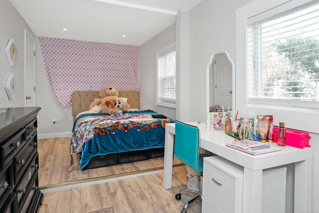 bedroom with light hardwood / wood-style flooring