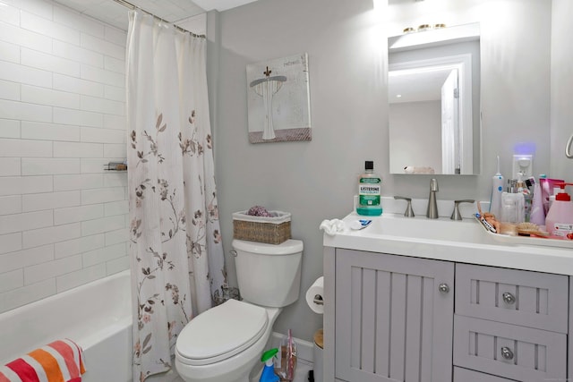 full bathroom featuring shower / tub combo with curtain, vanity, and toilet