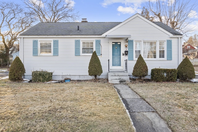 view of front of property with a front lawn