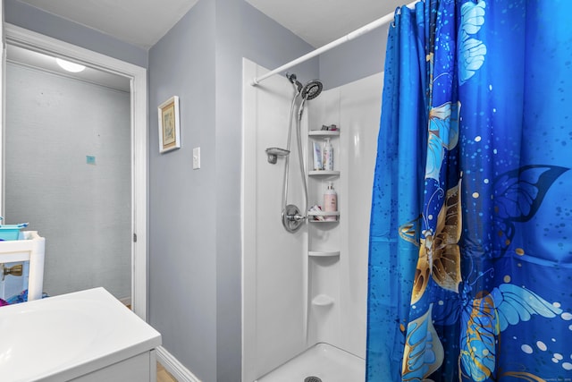 bathroom with vanity and a shower with shower curtain