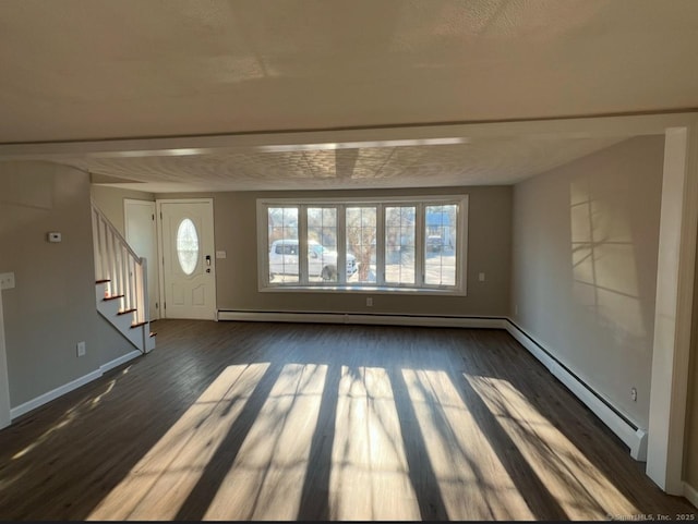 entrance foyer with dark hardwood / wood-style floors and baseboard heating