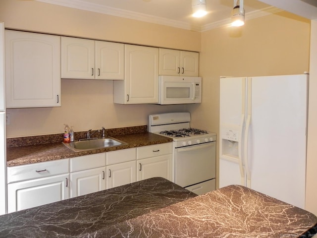 kitchen with sink, white appliances, ornamental molding, and white cabinets