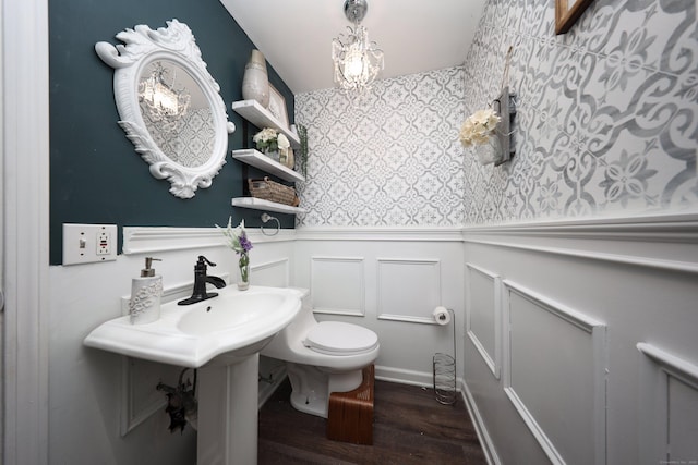 bathroom featuring wood-type flooring and toilet