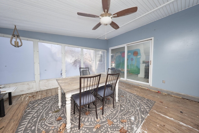 dining room with ceiling fan and hardwood / wood-style floors