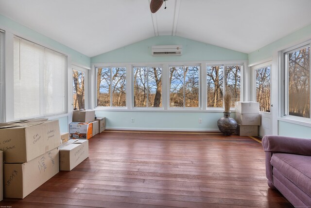 unfurnished sunroom featuring lofted ceiling and an AC wall unit