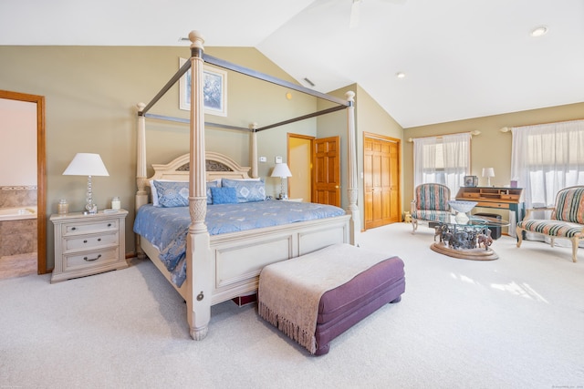 carpeted bedroom with vaulted ceiling