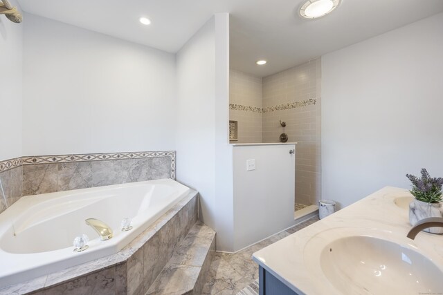 full bath featuring recessed lighting, walk in shower, a bath, and vanity