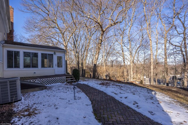 yard layered in snow with cooling unit